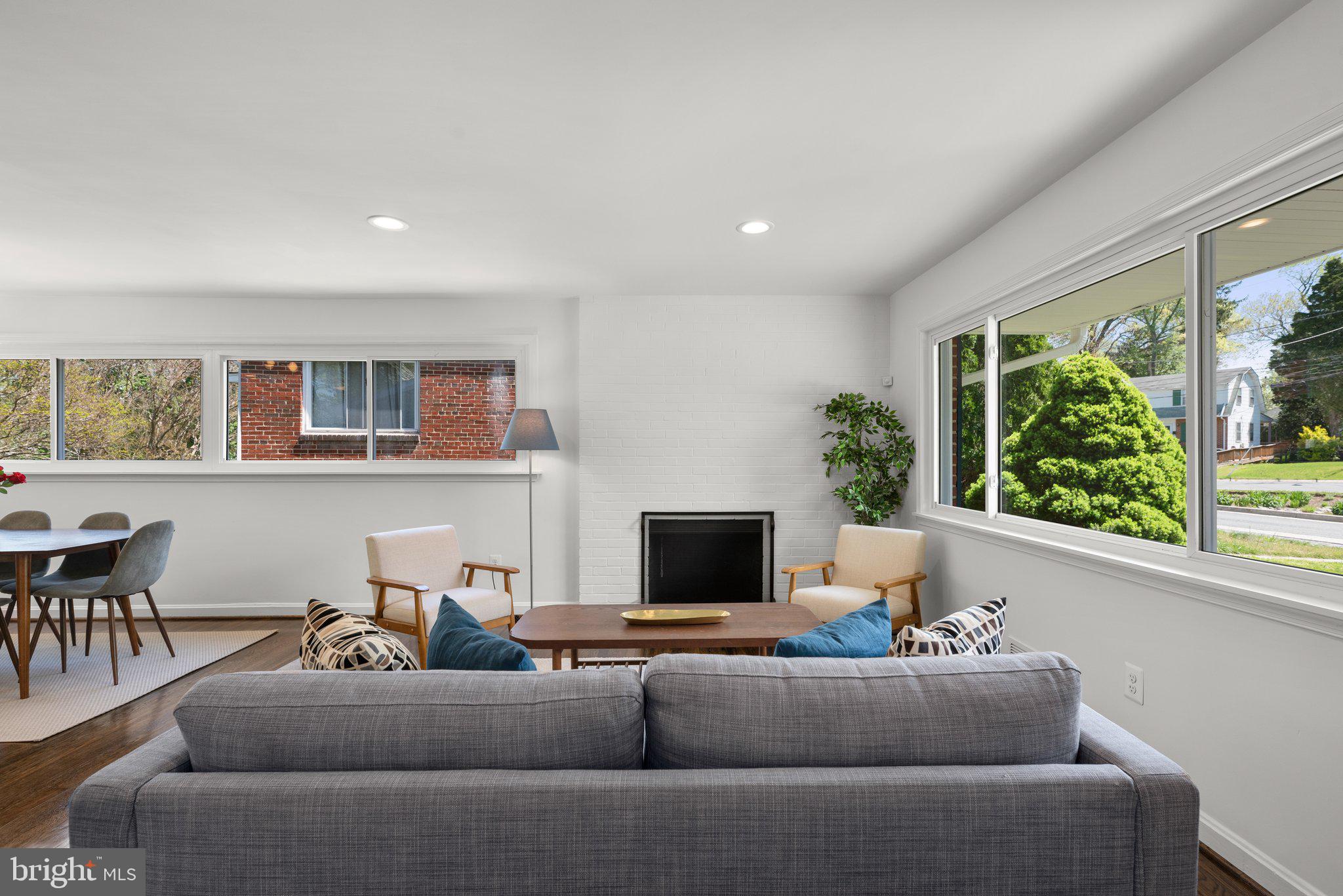 10126 Renfrew Road Silver Spring, MD 20901 - Photo 7 of 40 a living room with furniture and a flat screen tv