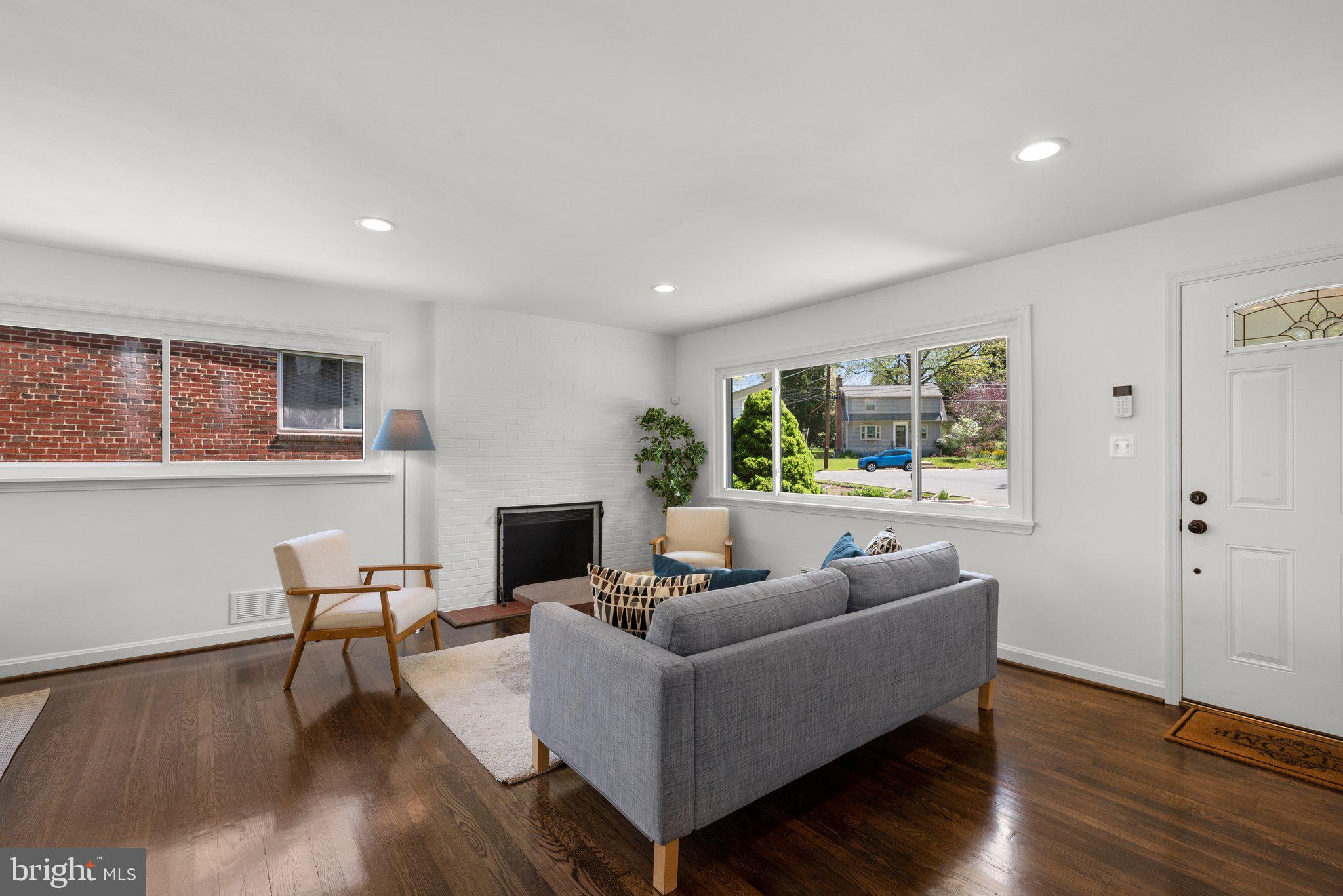 10126 Renfrew Road Silver Spring, MD 20901 - Photo 8 of 40 a living room with furniture and a fireplace