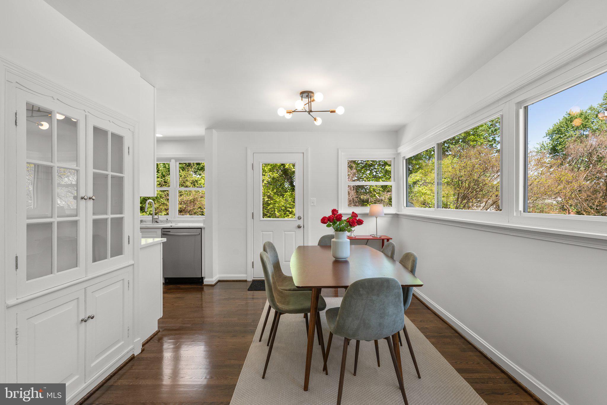10126 Renfrew Road Silver Spring, MD 20901 - Photo 9 of 40 a view of a dining room with furniture window and wooden floor