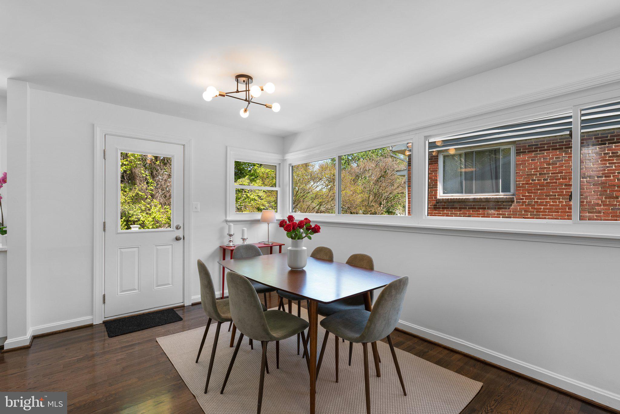 10126 Renfrew Road Silver Spring, MD 20901 - Photo 10 of 40 a view of a dining room with furniture window and wooden floor