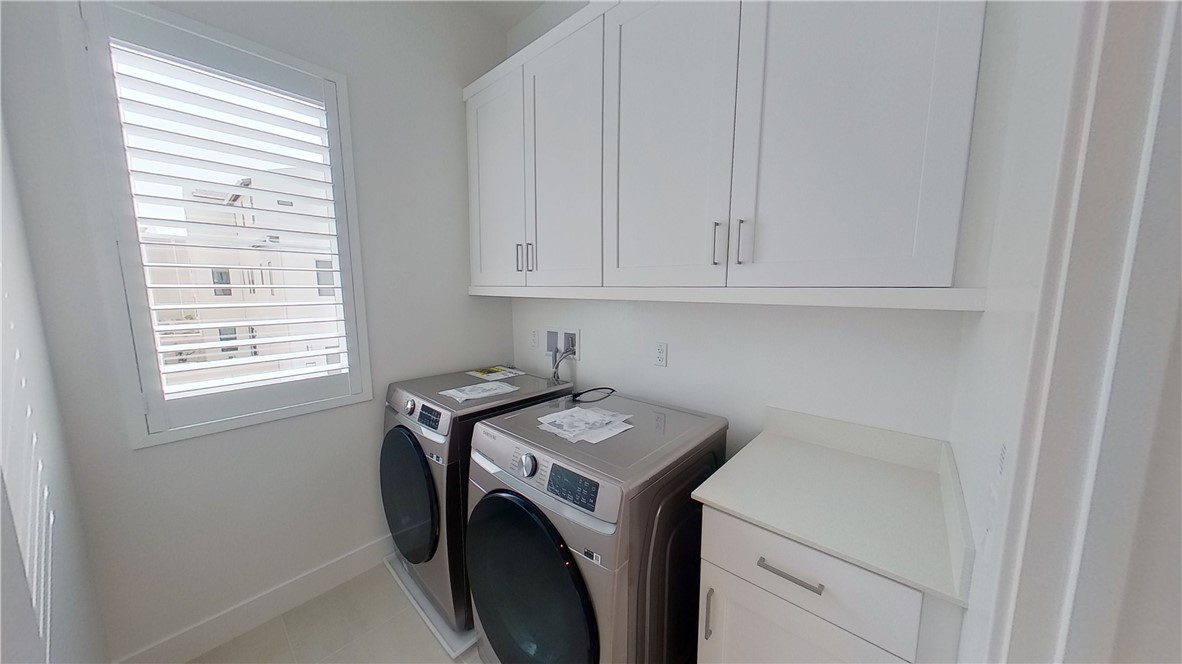 106 Yugen Irvine, CA 92618 - Photo 14 of 28 a utility room with dryer and washer