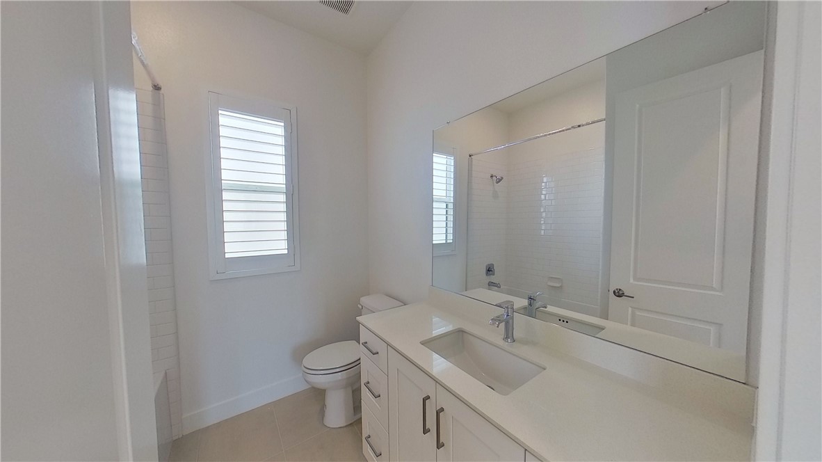106 Yugen Irvine, CA 92618 - Photo 15 of 28 a bathroom with a toilet sink and mirror