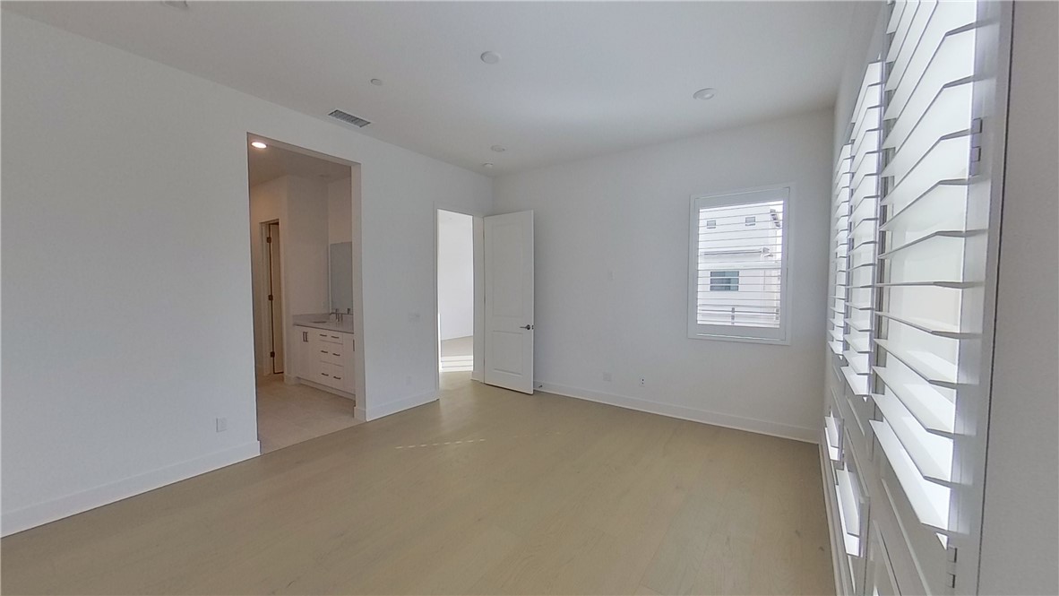 106 Yugen Irvine, CA 92618 - Photo 18 of 28 a view of an empty room with a window