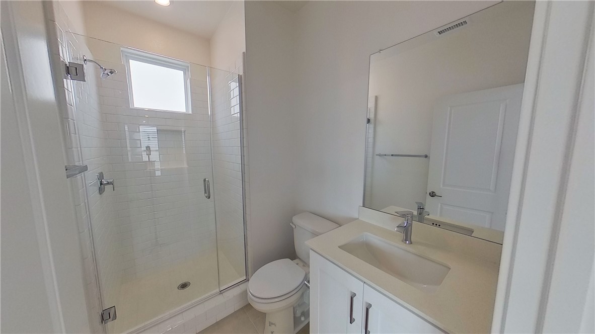 106 Yugen Irvine, CA 92618 - Photo 25 of 28 a bathroom with a sink toilet and shower