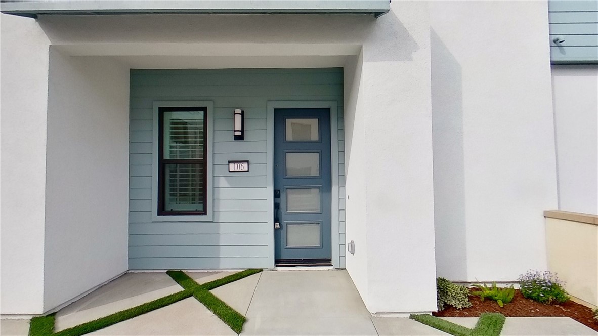 106 Yugen Irvine, CA 92618 - Photo 26 of 28 a front view of a house with a garage