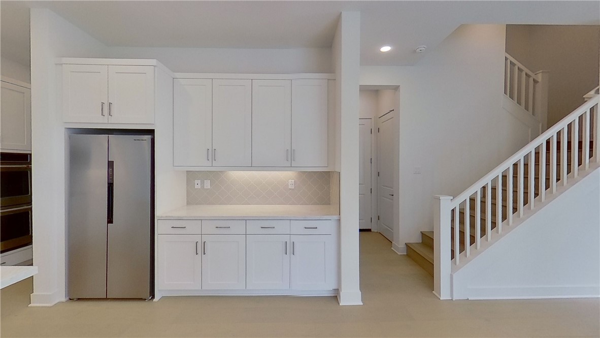 106 Yugen Irvine, CA 92618 - Photo 5 of 28 a view of a kitchen with white cabinets