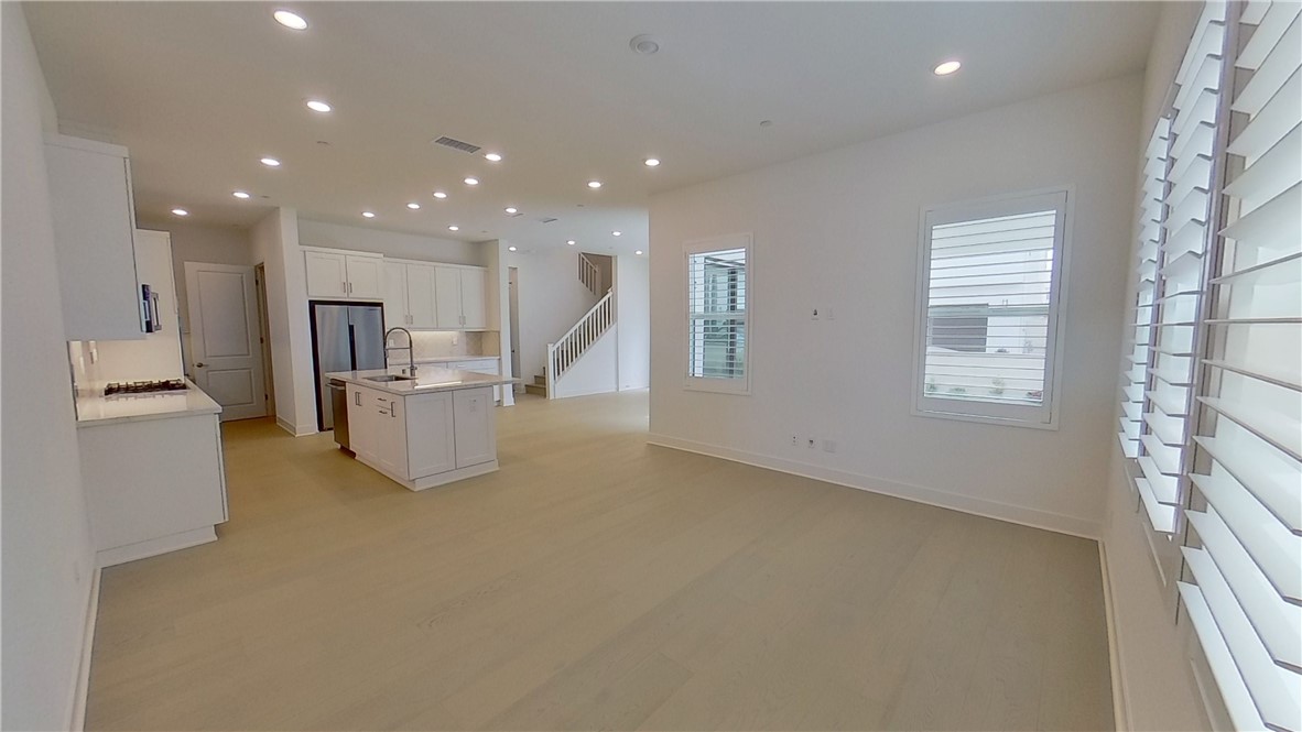 106 Yugen Irvine, CA 92618 - Photo 7 of 28 a view of kitchen with furniture and refrigerator