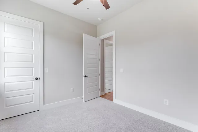 a view of an empty room and closet