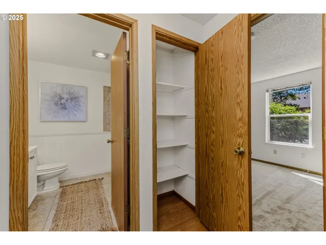 a view of a bathroom with a glass door and shower
