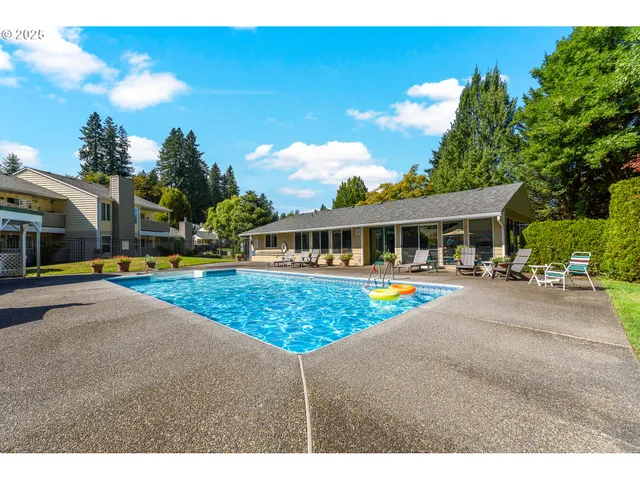 an aerial view of a residential houses with outdoor space