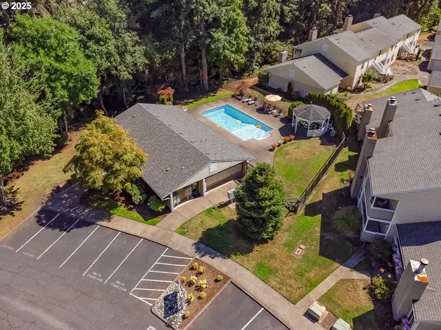 an aerial view of multiple houses with yard