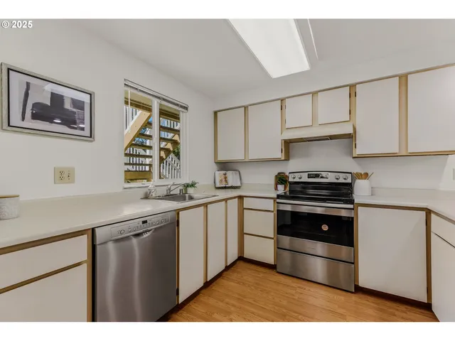 a view of a kitchen from the hallway