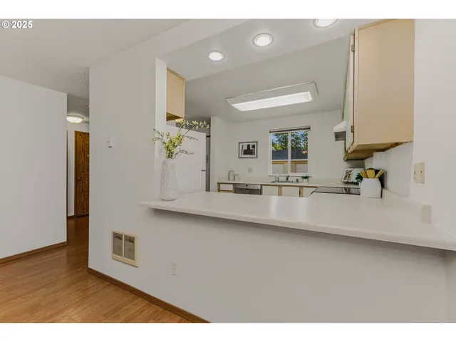 a kitchen with a sink appliances and cabinets
