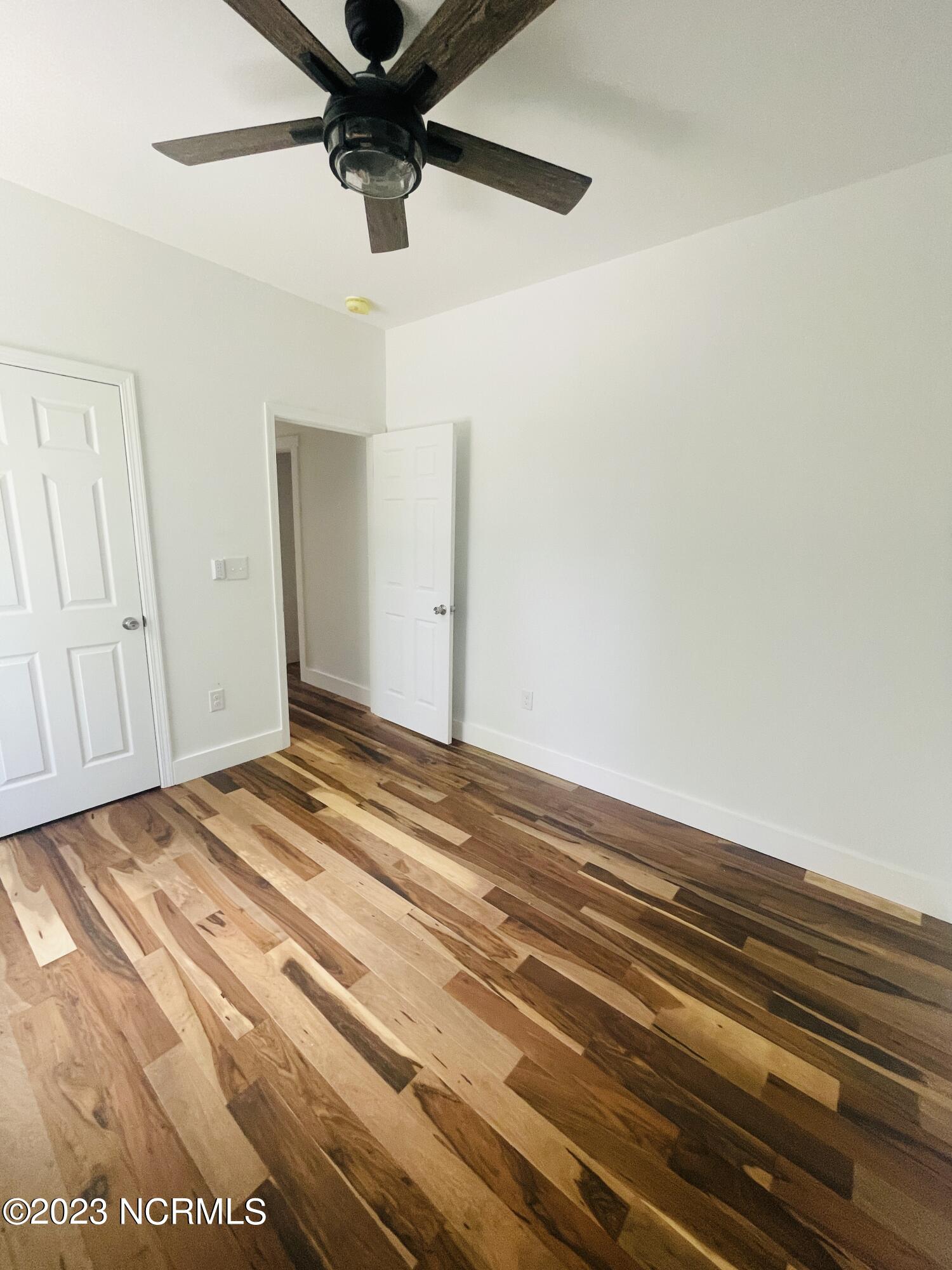 213 Sanders Street Tabor City, NC 28463 - Photo 11 of 25 This master bedroom is complete with a in suite closet.