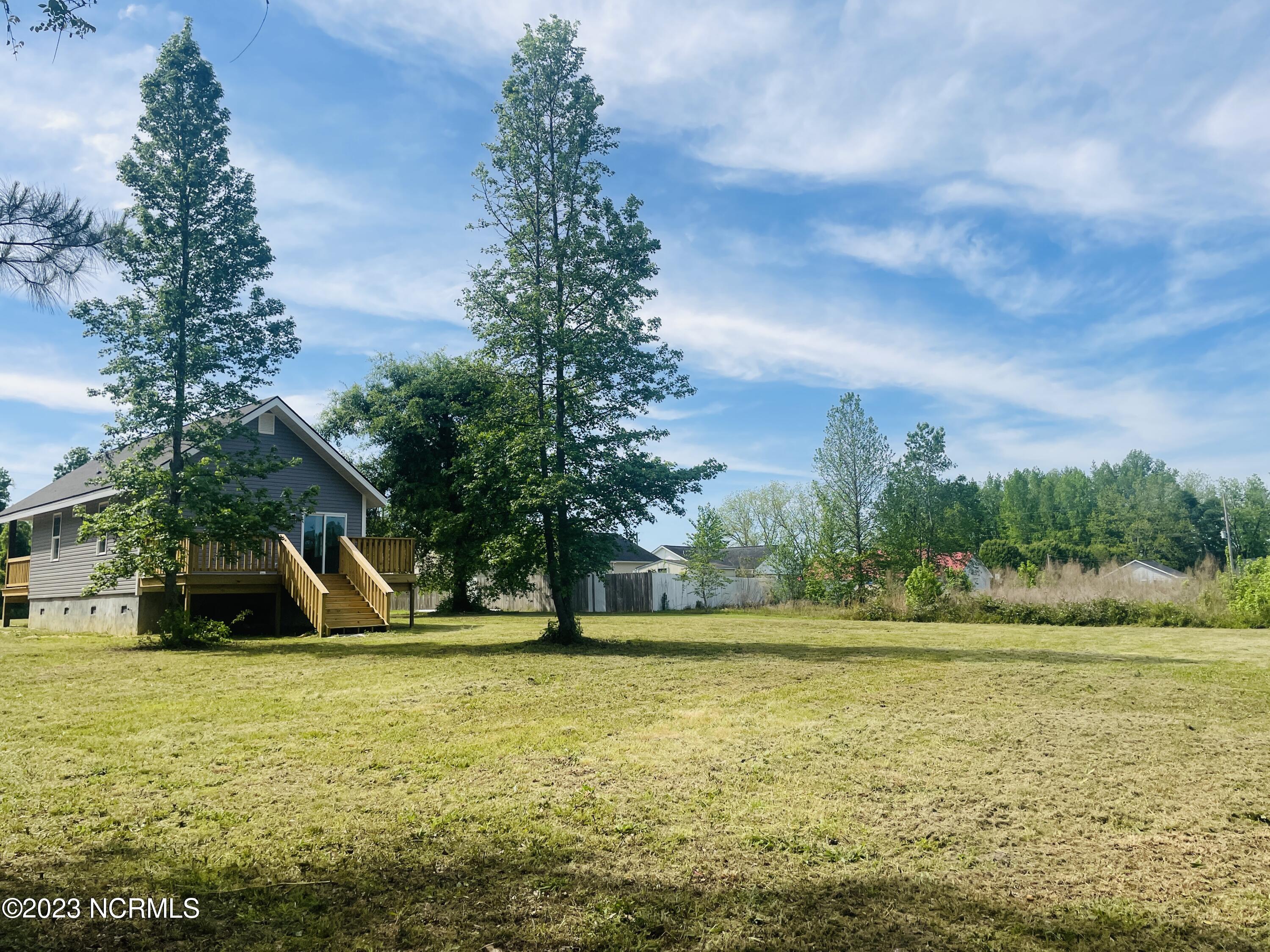 213 Sanders Street Tabor City, NC 28463 - Photo 22 of 25 This large back yard is ready for you to make your own.