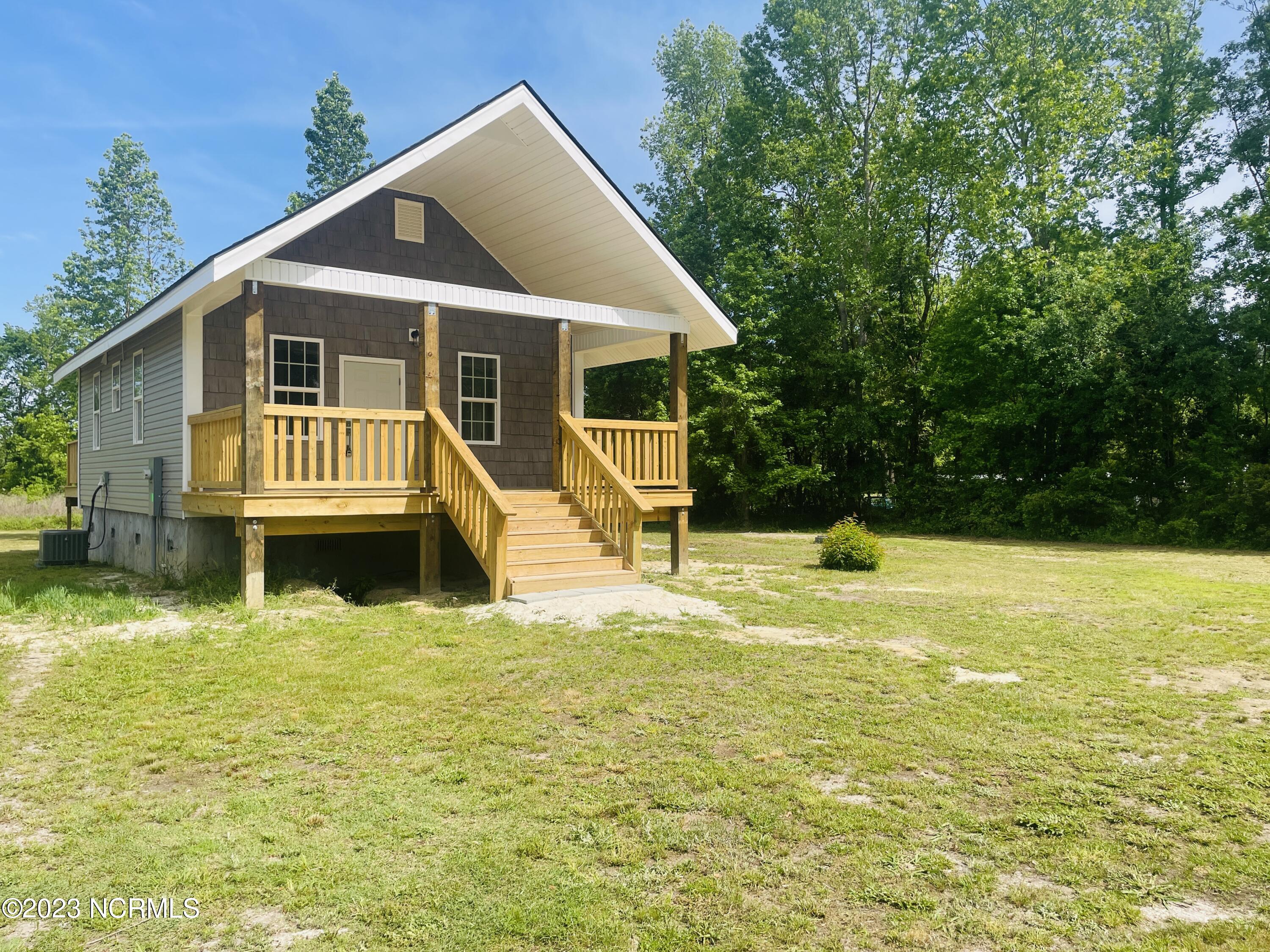 213 Sanders Street Tabor City, NC 28463 - Photo 3 of 25 Spacious front lawn will be seeded with fresh grass.