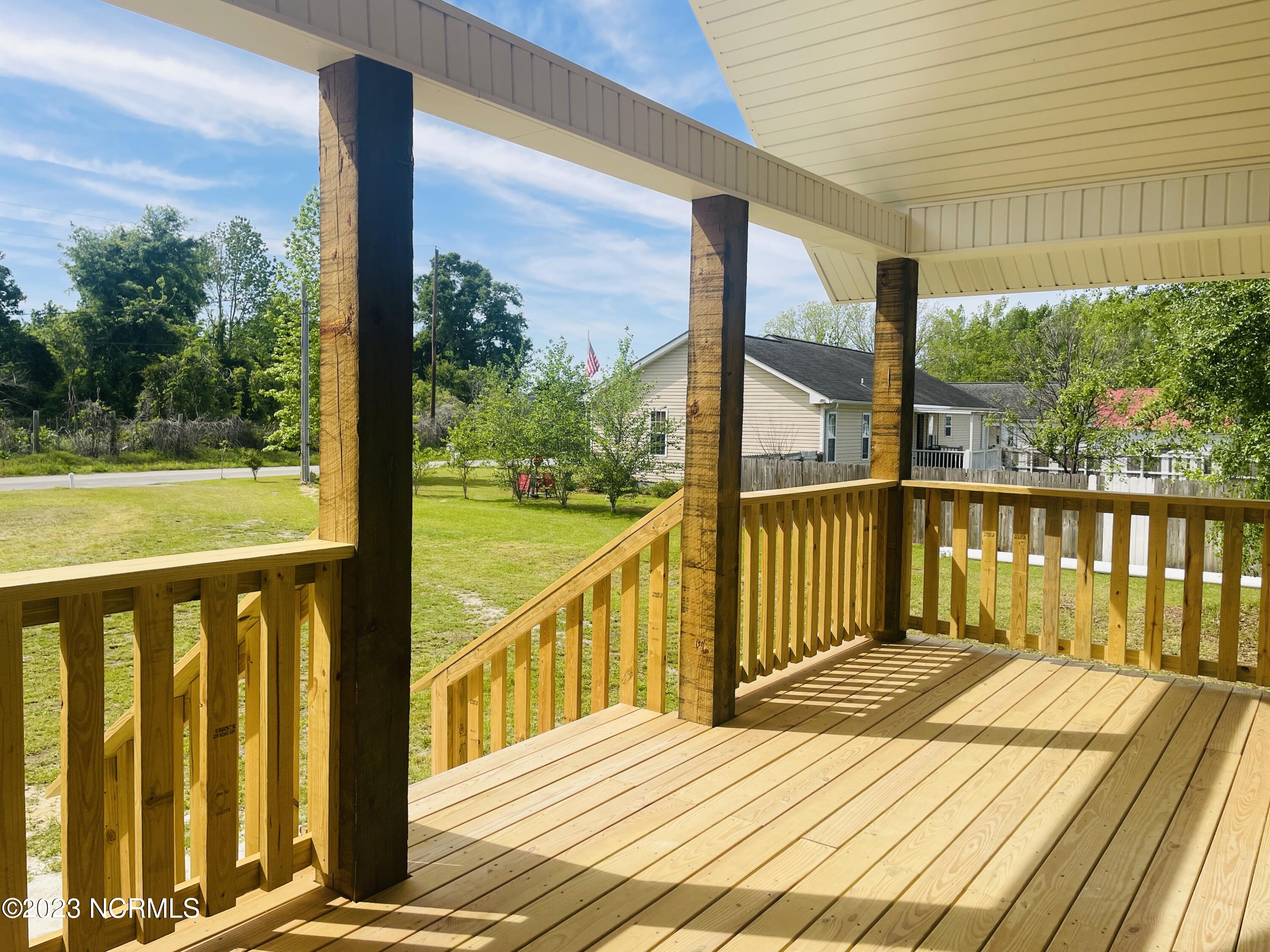 213 Sanders Street Tabor City, NC 28463 - Photo 4 of 25 Enjoy this large covered front porch.