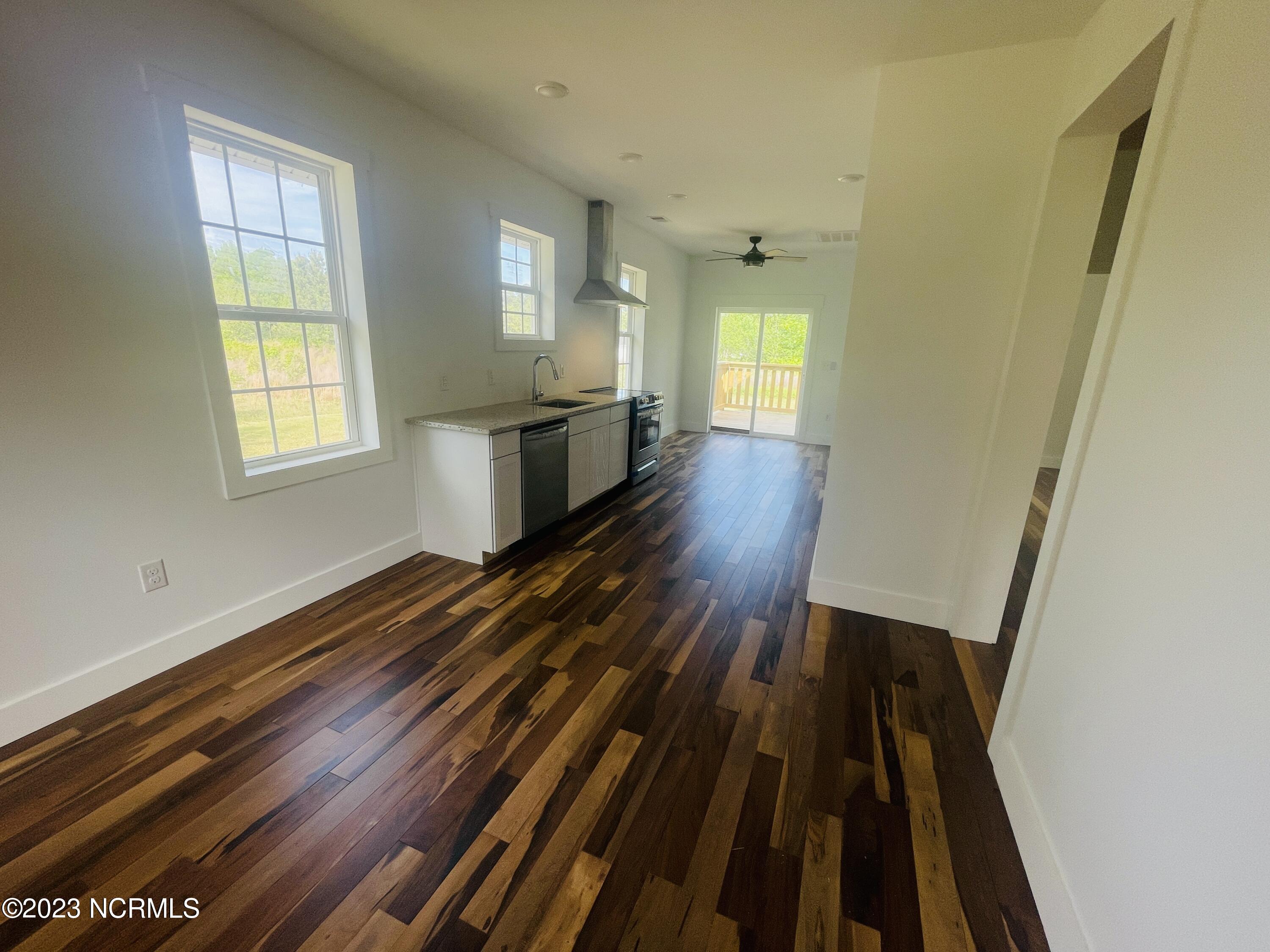 213 Sanders Street Tabor City, NC 28463 - Photo 5 of 25 The 9 Ft. tall ceilings add tons of space to this cottage.