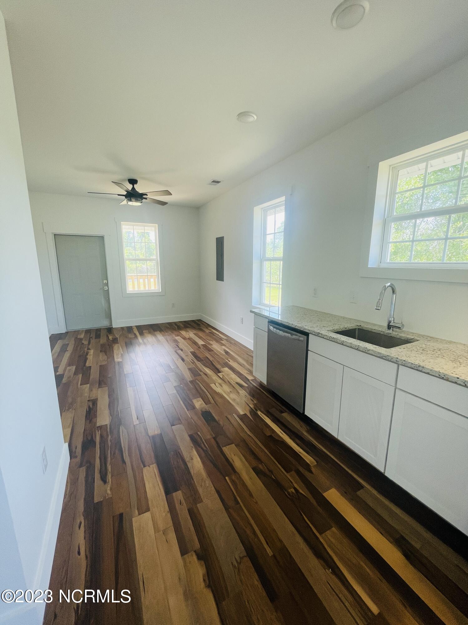 213 Sanders Street Tabor City, NC 28463 - Photo 7 of 25 Remote controlled ceiling fan in your main living area.