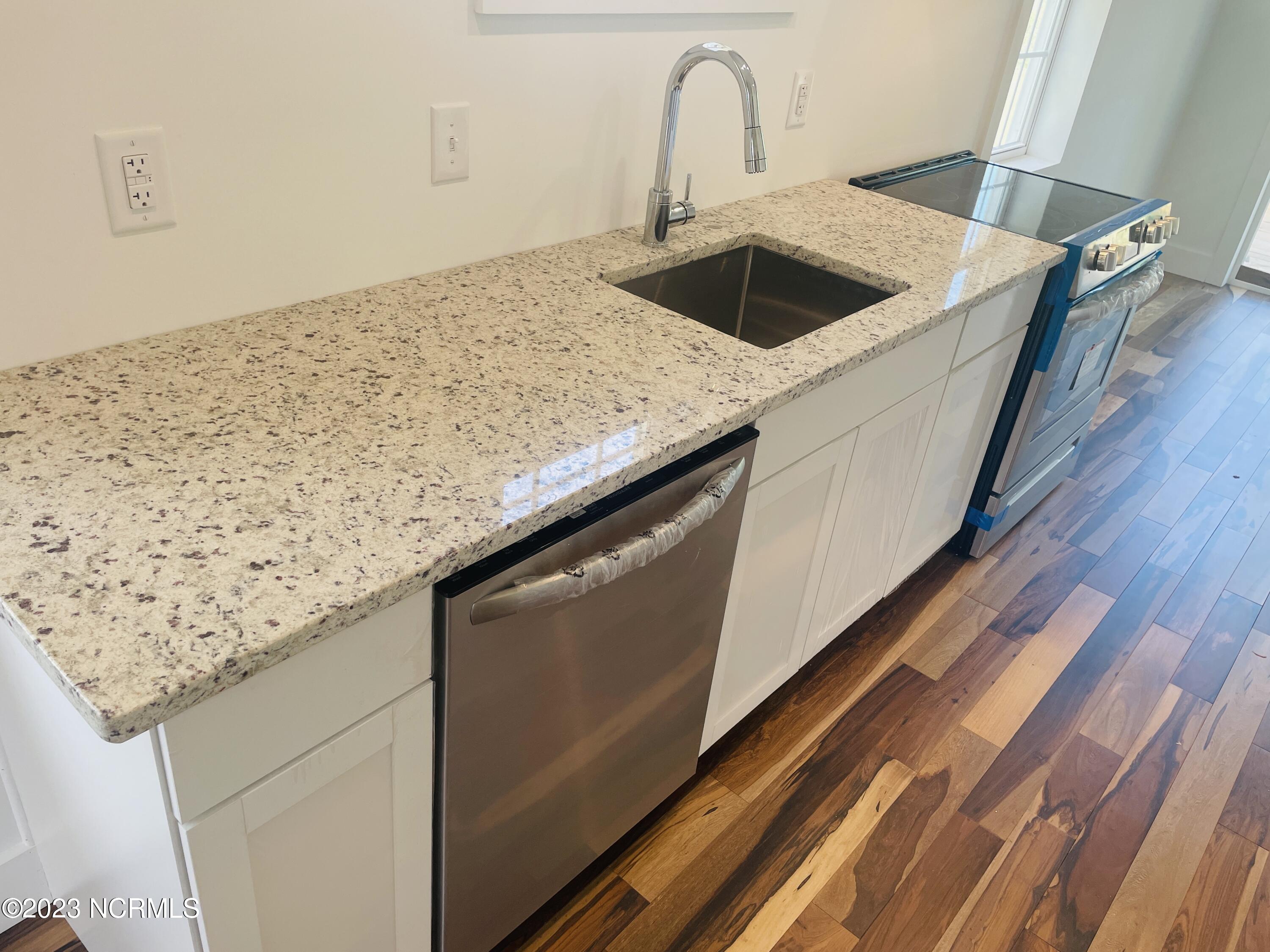 213 Sanders Street Tabor City, NC 28463 - Photo 8 of 25 Enjoy upgraded stainless steel appliances and an under counter mounted farm house sink.