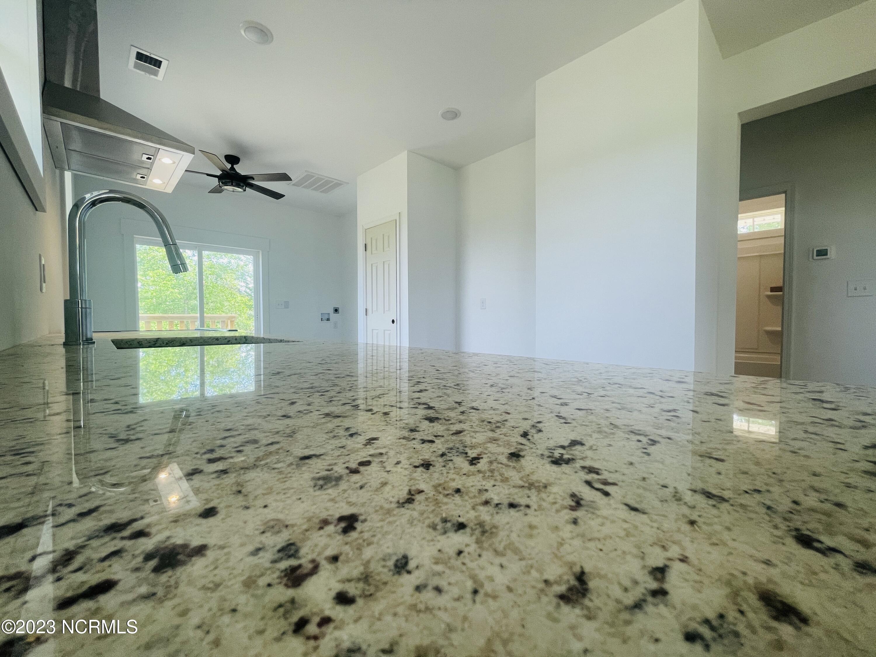 213 Sanders Street Tabor City, NC 28463 - Photo 9 of 25 Enjoy Decorative White granite counter tops in your kitchen.