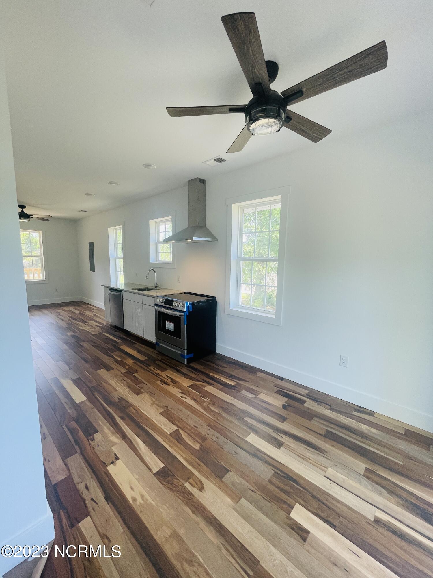 213 Sanders Street Tabor City, NC 28463 - Photo 10 of 25 Enjoy a ceiling fan and sliding glass door leading to your backyard deck