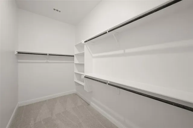 a view of an empty walk in closet