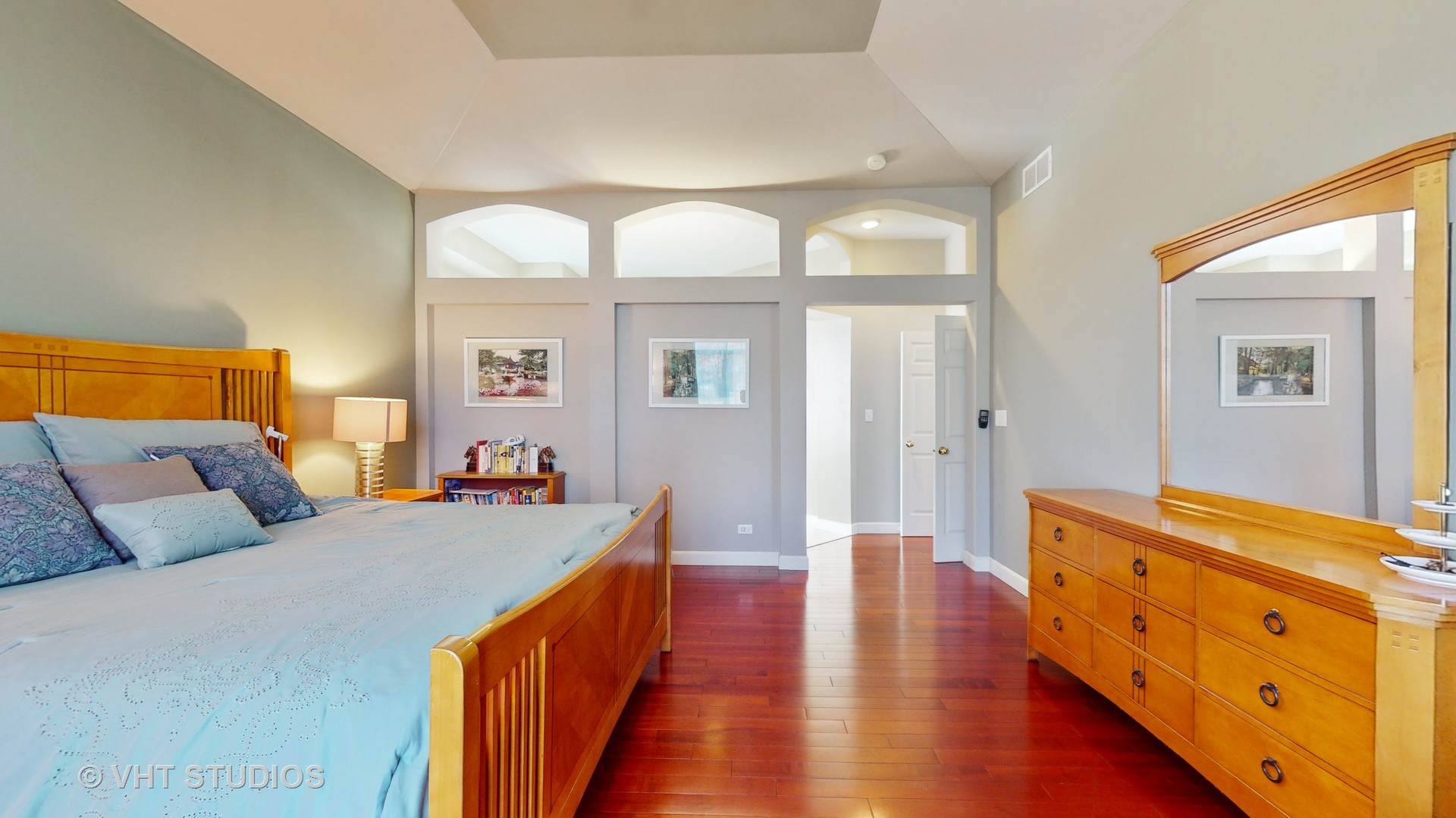 811 Commons Road Naperville, IL 60563 - Photo 19 of 61 a bedroom with furniture and wooden floor