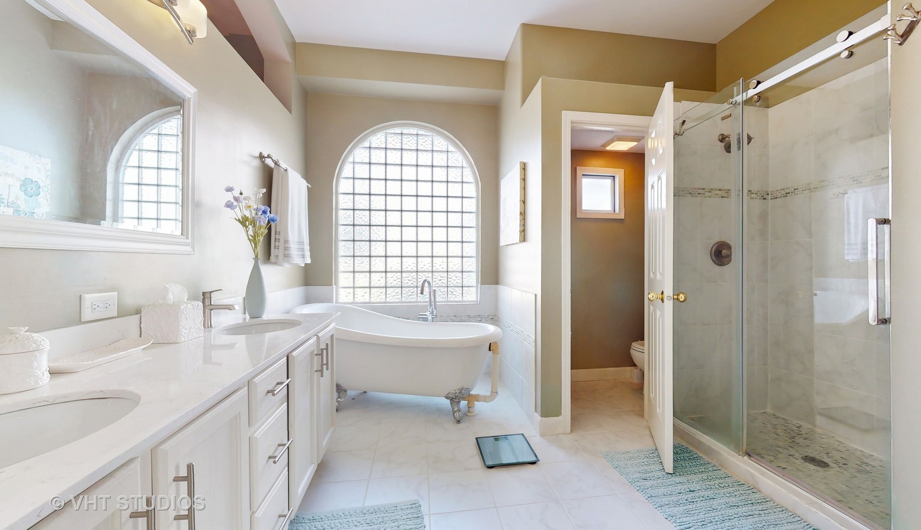 811 Commons Road Naperville, IL 60563 - Photo 20 of 61 a spacious bathroom with double vanity sink a mirror and a shower