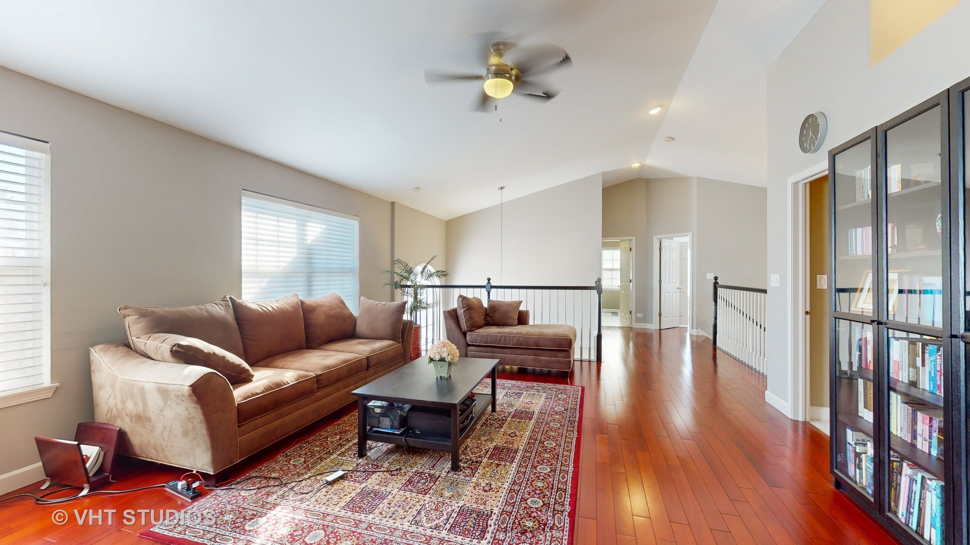 811 Commons Road Naperville, IL 60563 - Photo 24 of 61 a living room with furniture and a wooden floor