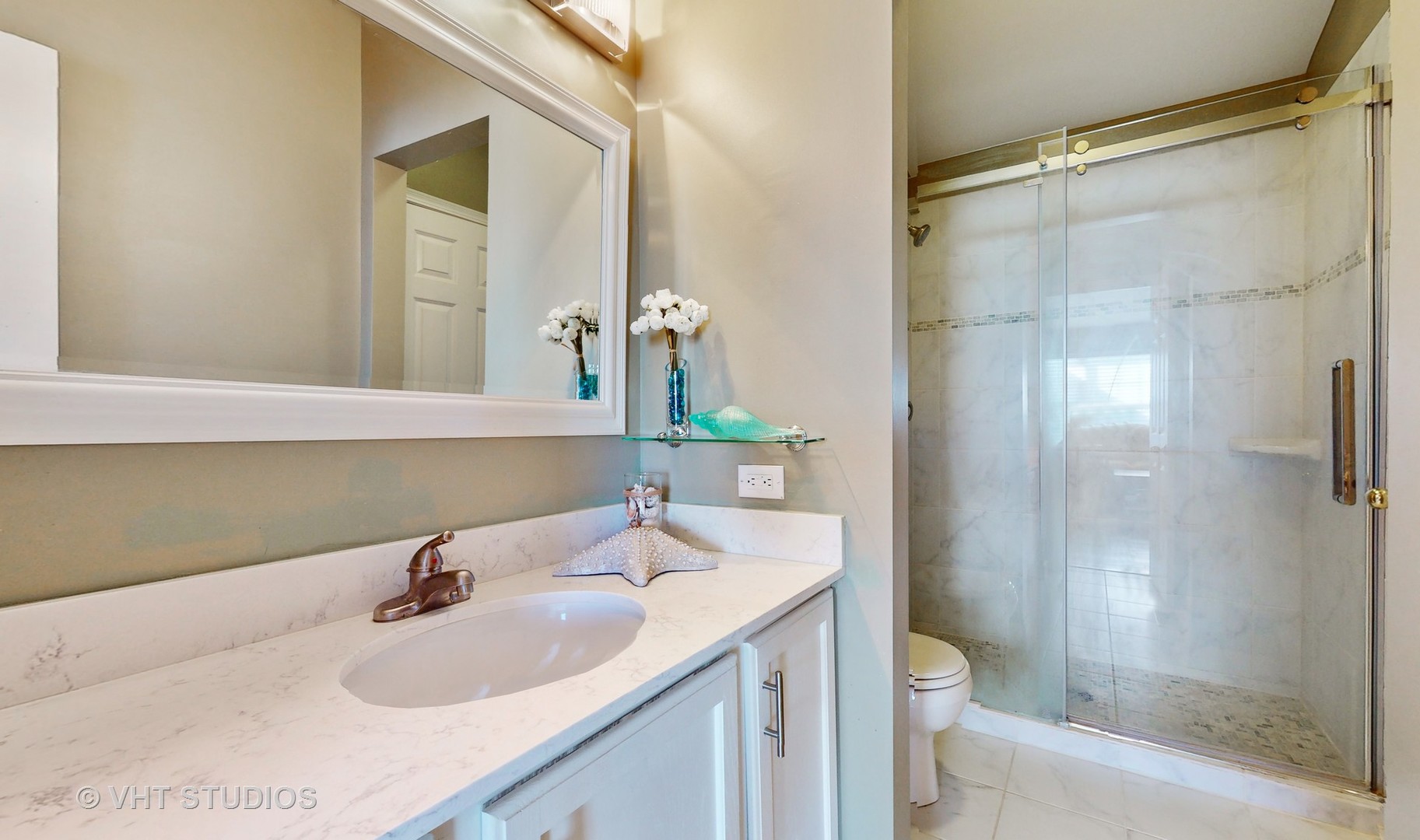 811 Commons Road Naperville, IL 60563 - Photo 25 of 61 a bathroom with a sink toilet and shower