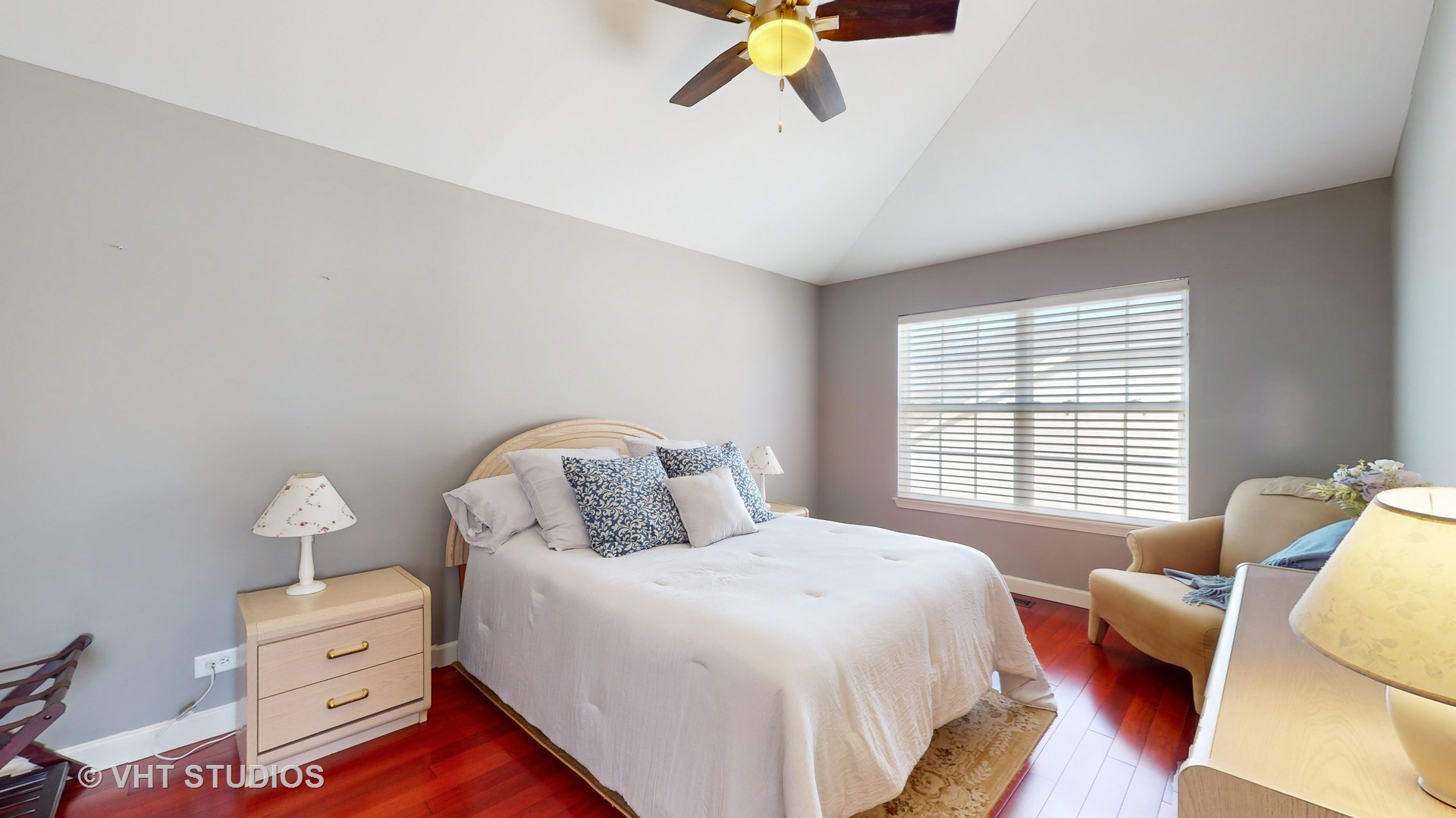 811 Commons Road Naperville, IL 60563 - Photo 27 of 61 a bedroom with a bed and wooden floor