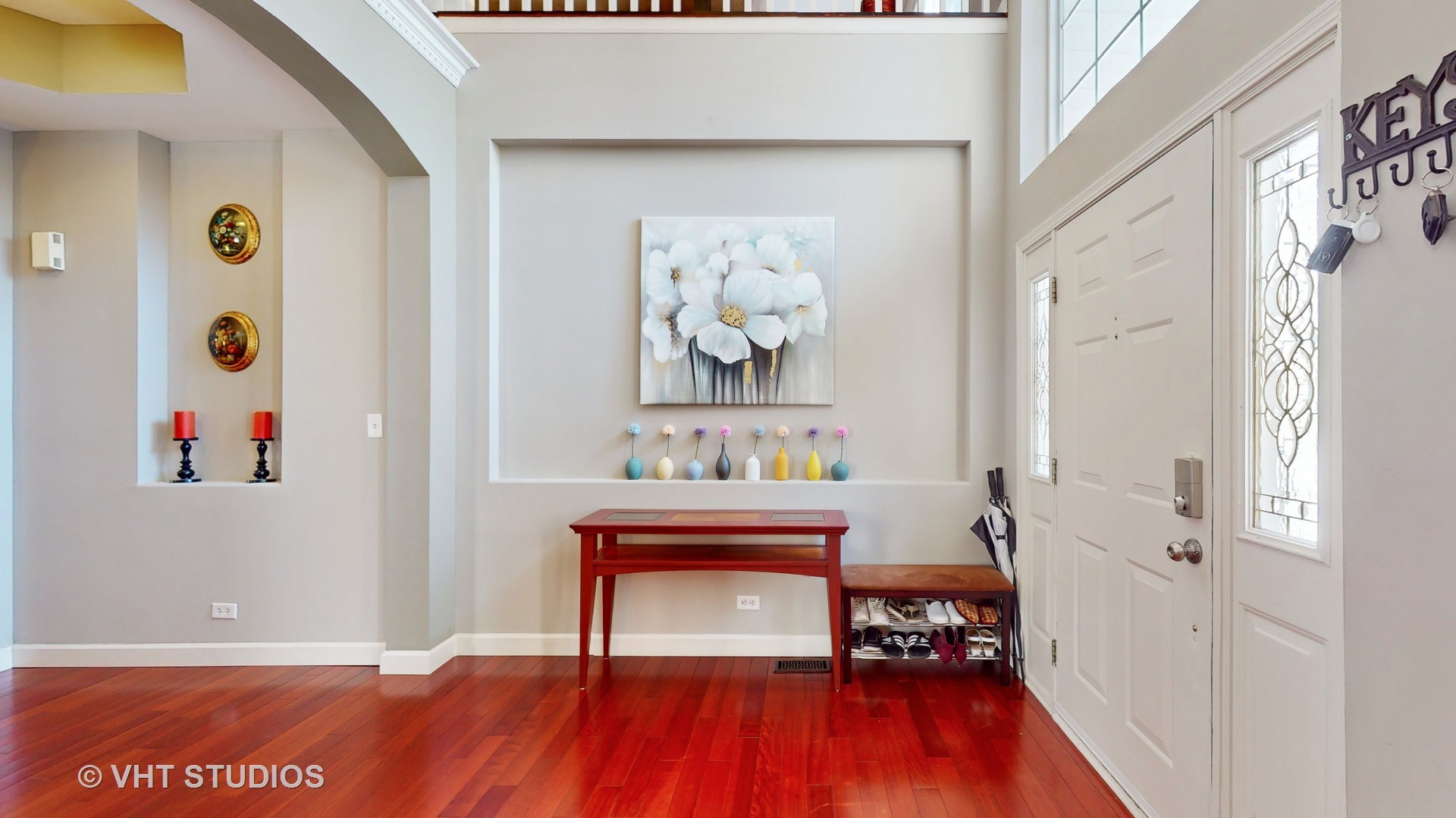 811 Commons Road Naperville, IL 60563 - Photo 4 of 61 a view of a hallway with wooden floor and furniture