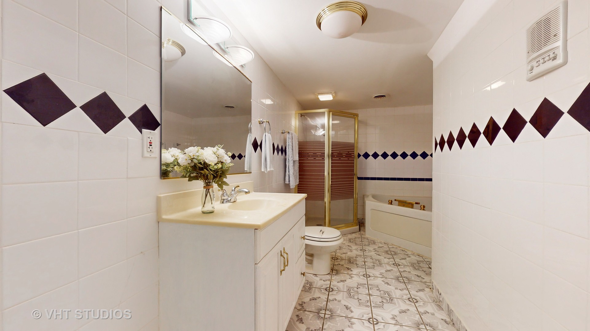 811 Commons Road Naperville, IL 60563 - Photo 46 of 61 a bathroom with a sink toilet and shower