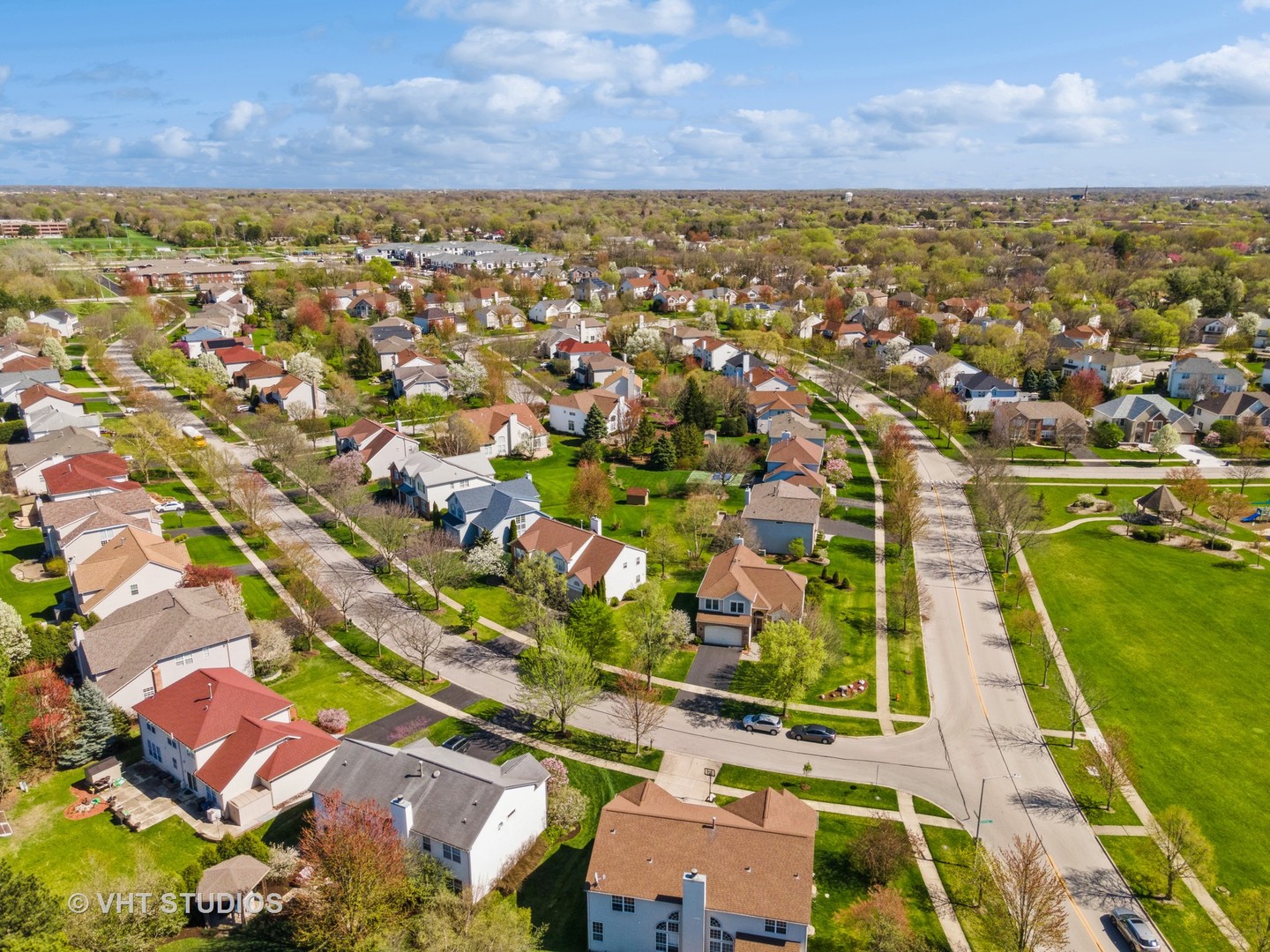 811 Commons Road Naperville, IL 60563 - Photo 52 of 61 an aerial view of residential building with outdoor space and a lake view