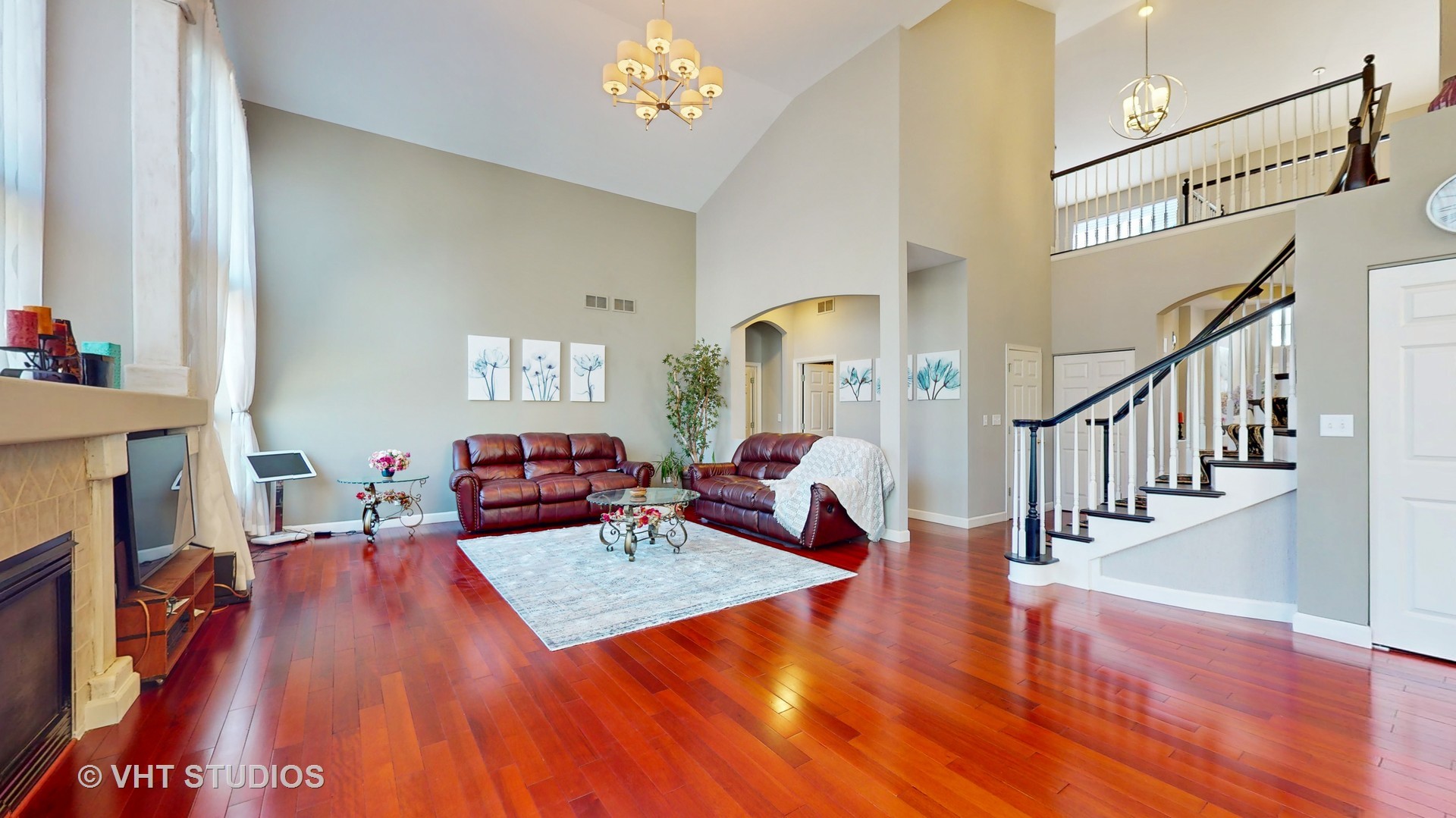 811 Commons Road Naperville, IL 60563 - Photo 8 of 61 a living room with furniture and a wooden floor