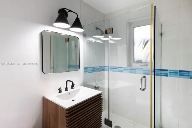 a bathroom with a sink and mirror