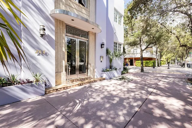 a view of a building with trees