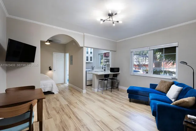a living room with furniture and a flat screen tv