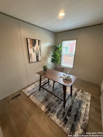 a living room with couch and a rug