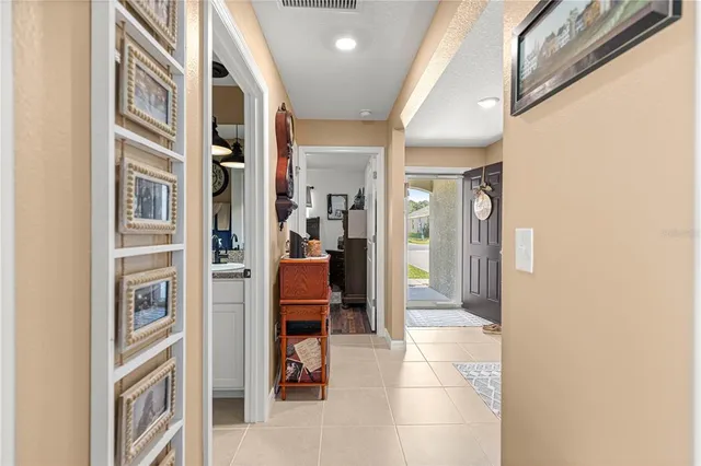 a large kitchen with stainless steel appliances granite countertop a lot of counter space and wooden floor