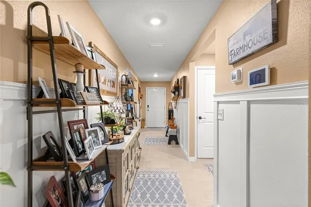 a living room with furniture ceiling fan and a rug