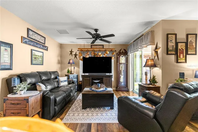 a swimming pool with an outdoor space and seating area