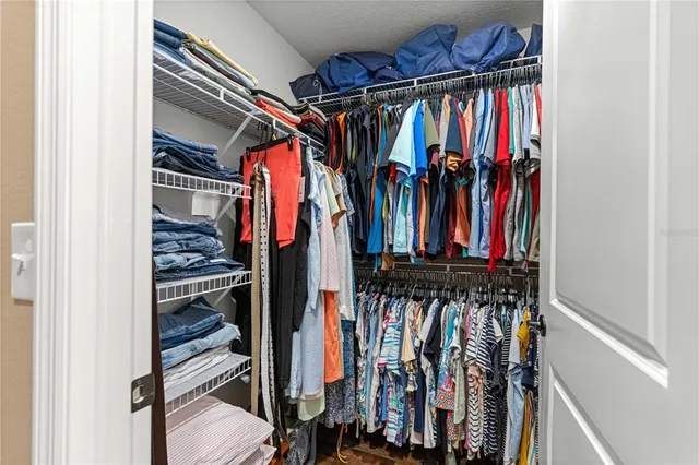 an aerial view of residential houses with outdoor space and swimming pool