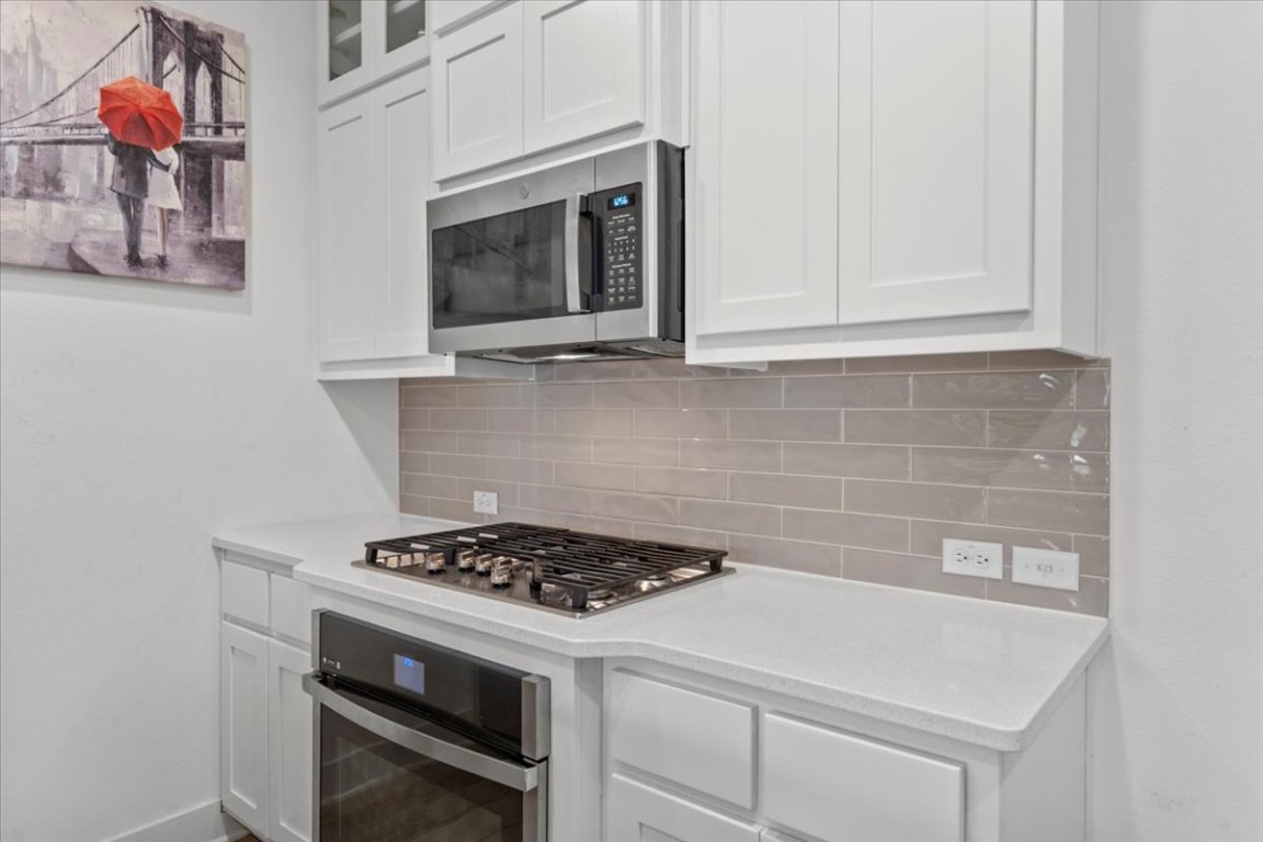 2516 Simond Avenue, Unit D Austin, TX 78723 - Photo 12 of 31 Kitchen with stainless steel appliances.
