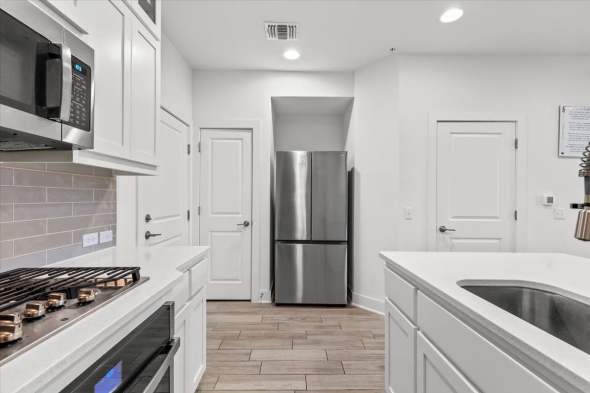 2516 Simond Avenue, Unit D Austin, TX 78723 - Photo 14 of 31 Kitchen with stainless steel Refrigerator.
