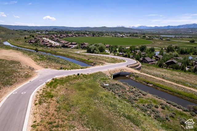 883 Wasatch View Drive, Unit 11 Kamas, UT 84036 - Photo 1 of 14 Aerial perspective of suburban area featuring a water and mountain view