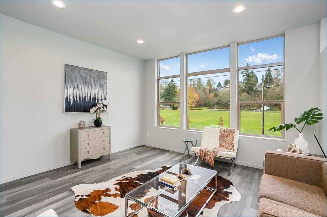 5257 Fauntleroy Way Southwest Seattle, WA 98136 - Photo 2 of 27 a living room with furniture and a window