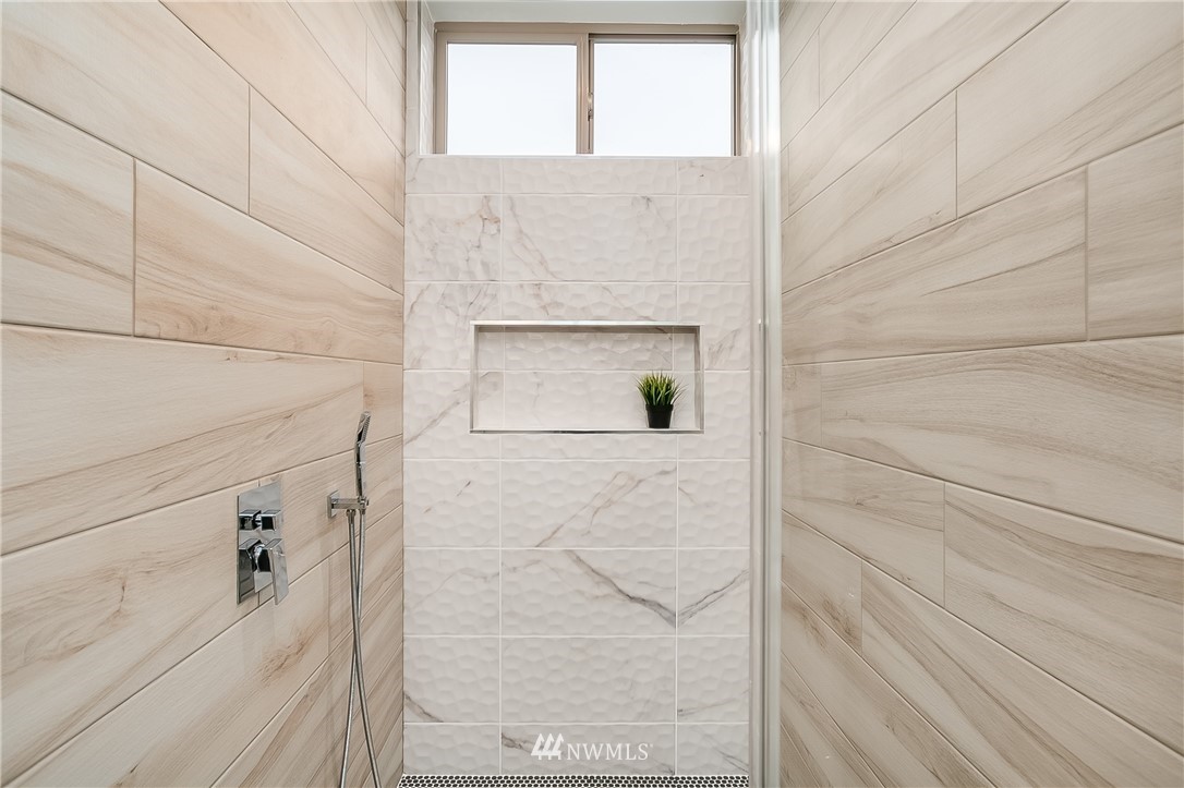 5257 Fauntleroy Way Southwest Seattle, WA 98136 - Photo 14 of 27 a bathroom with a shower