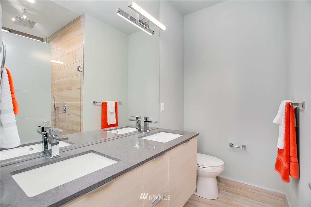 5257 Fauntleroy Way Southwest Seattle, WA 98136 - Photo 15 of 27 a bathroom with a sink and a mirror